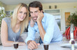 Happy young couple standing in home kitchen Happy young couple standing in home kitchen