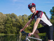 Photo: young man training on mountain bike young man training on mountain bike