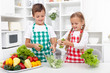 Kids in the kitchen preparing salad Kids in the kitchen preparing salad