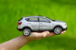 Foto: Hand with toy car Hand with toy car