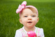 Photo: Adorable baby holding a pink Easter egg Adorable baby holding a pink Easter egg
