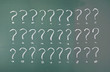 Drawing question marks on blackboard. Drawing question marks on blackboard.