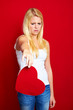 young disappointed woman with a heart