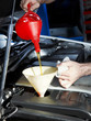 Oil change of  a car in a garage