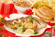 carp baked with almonds on christmas table