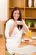 Breakfast at home happy woman with coffee Breakfast at home happy woman with coffee