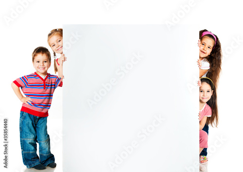 Photo: kids beside a white blank kids beside a white blank