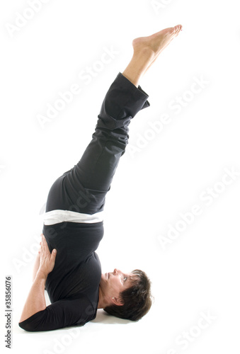 Photo: woman yoga position toe raise Half Shoulderstand -- Ardha Sarvan woman yoga position toe raise Half Shoulderstand -- Ardha Sarvan