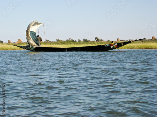 Photo: Fishermen in a pirogue in the Niger river. Fishermen in a pirogue in the Niger river.