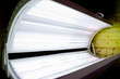 Photo: Open tanning bed with lit white bulbs Open tanning bed with lit white bulbs