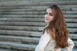 Girl turning back against stairs background Girl turning back against stairs background