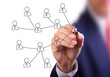 business man hand writing social network on whiteboard business man hand writing social network on whiteboard