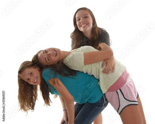 Photo: Three teenage girls having friendly fun together Three teenage girls having friendly fun together