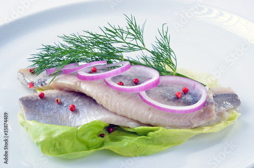 Photo: Salzheringe auf Salatblatt Salzheringe auf Salatblatt