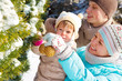 Family decorating fir tree