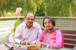 Photo: Couple retired lifestyle enjoy fresh air and balcony meal Couple retired lifestyle enjoy fresh air and balcony meal