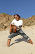 Guitar player on the rocks