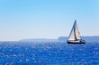 Blue Mediterranean sailboat sailing