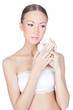 Young beautiful woman holding flower in her hands