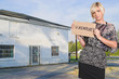 Photo: Woman Holding an Unemployment Sign Woman Holding an Unemployment Sign