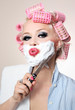 Girl is having a shave using knife
