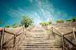 Wood stairs to beuatiful blue sky with clouds