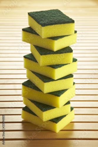 Photo: sponges mountain on wooden background sponges mountain on wooden background