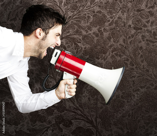 Photo: young man shouting young man shouting
