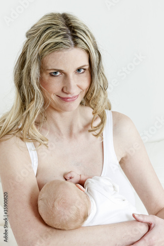 Photo: portrait of mother nursing her baby portrait of mother nursing her baby