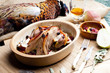 baked pheasant with bacon, pear, raisins on brandy
