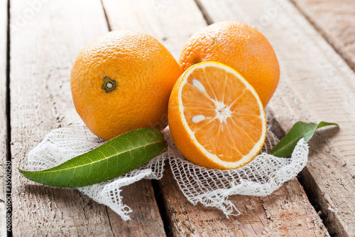 Photo: Fresh oranges with leaves Fresh oranges with leaves