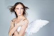 Beautiful elegant angel girl on gray  background
