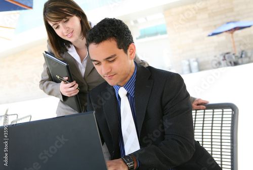 Photo: Man and Woman at Office Man and Woman at Office