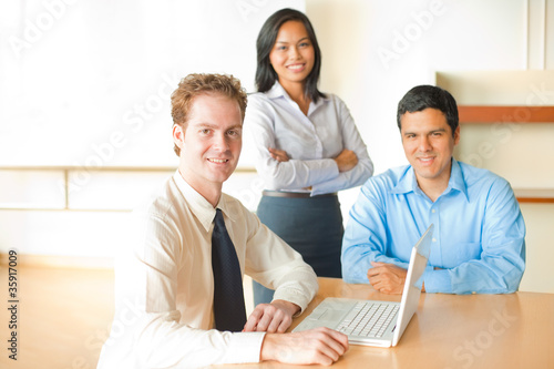 Photo: Caucasian Man Leads Business Meeting Caucasian Man Leads Business Meeting
