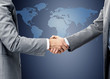 handshake over world map