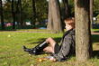 charming young woman in an autumn park