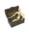 Model sitting in a treasure chest