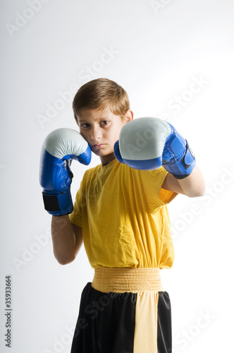 Photo: a child boxer in studio a child boxer in studio
