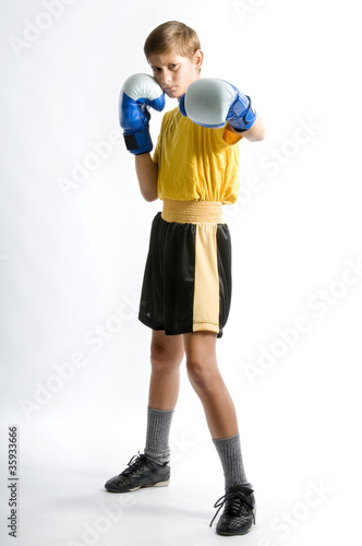 Photo: a child boxer in studio a child boxer in studio