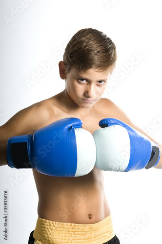 Photo: a child boxer in studio. a child boxer in studio.