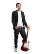 stylish man with guitar looking at camera