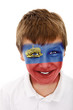 Young boy with liechtenstein flag painted on his face Young boy with liechtenstein flag painted on his face
