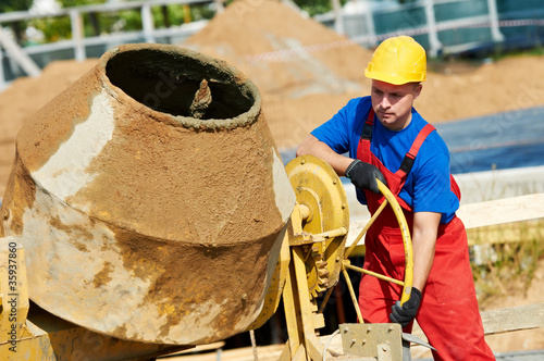 Photo: builder worker at construction site builder worker at construction site