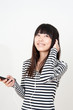 pretty asian woman listening music