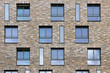 Abstract pattern of building facade with bricks and windows in B Abstract pattern of building facade with bricks and windows in B
