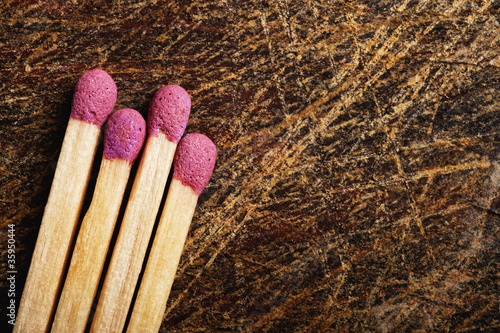 Photo: Matches on wooden table. Matches on wooden table.