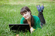 Active young sexy girl relaxing with laptop