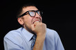 Photo: Businessman wearing glasses in horror watching stocks fall Businessman wearing glasses in horror watching stocks fall