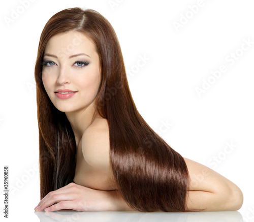 Photo: Beautiful fashion woman with long straight hairs - on white Beautiful fashion woman with long straight hairs - on white