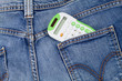 Calculator coming out of a jeans back pocket Calculator coming out of a jeans back pocket
